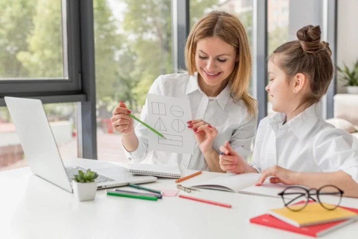Parent teaching child at home with homeschool books and educational supplies.