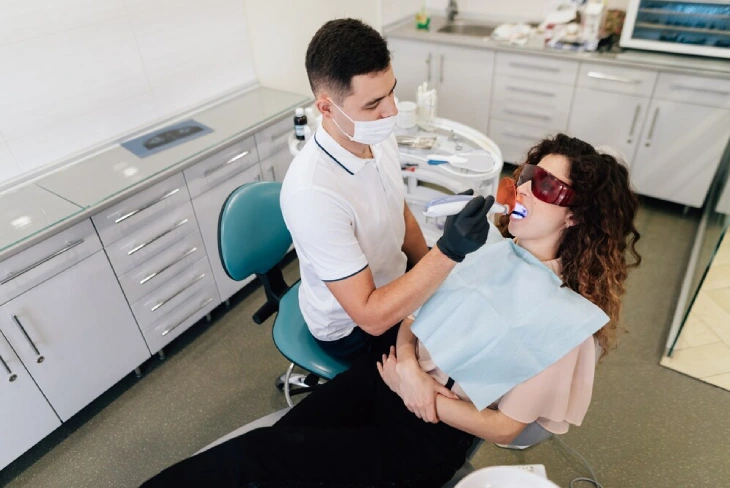 Patient arriving prepared for Preparing for Your Dental Appointment with necessary documents and confident smile.