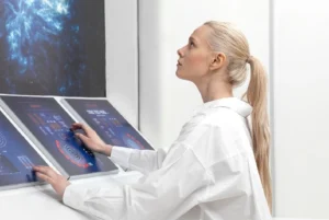 A medical professional analyzing Hormone levels on a digital screen.