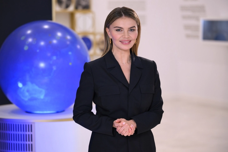 Lyasana Kabaeva in rhythmic gymnastics ribbon performance.
