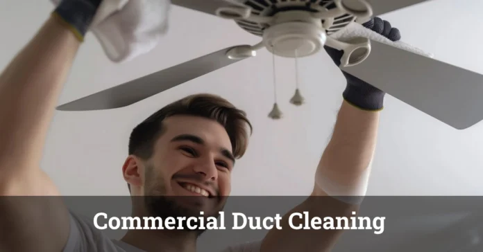 Technician using advanced equipment for Commercial Duct Cleaning to remove dust & improve indoor air quality in large business spaces.