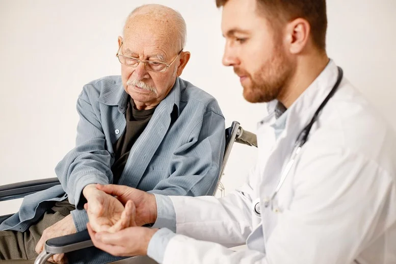 Senior receiving a health check-up from a doctor during a routine visit