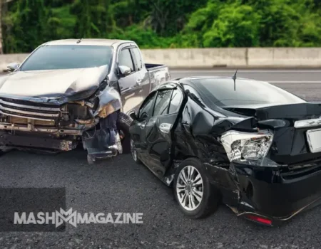 Car accident scene with crumpled vehicles and emergency responders, illustrating the importance of understanding car accident cases and legal processes.