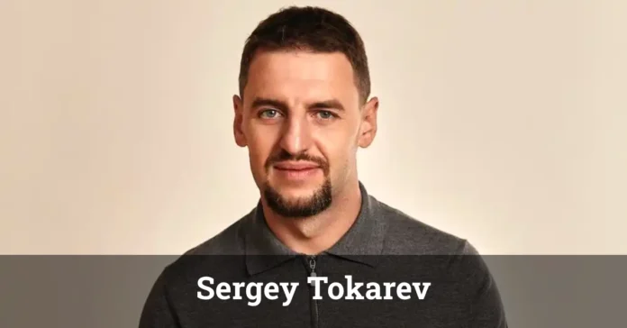 Sergey Tokarev speaking at a tech conference about entrepreneurship and innovation.