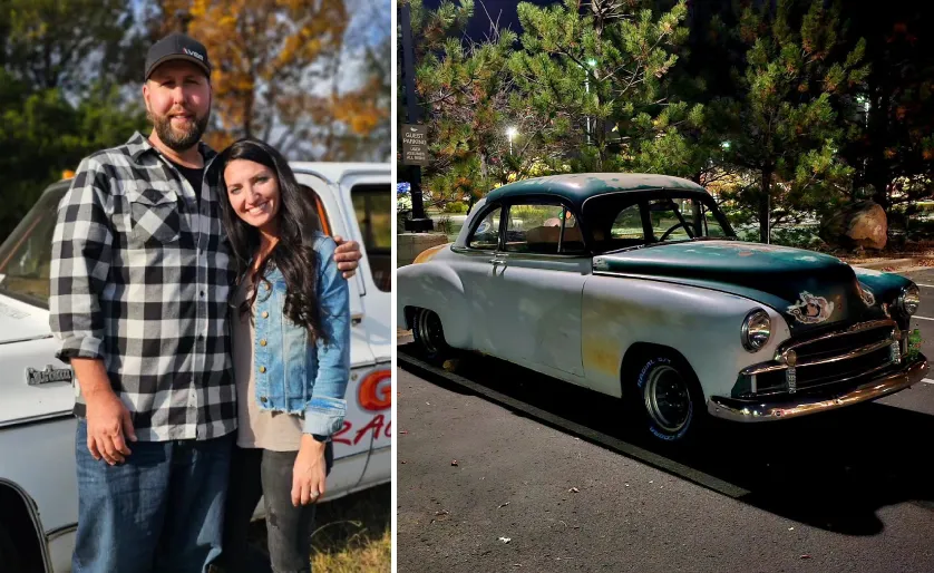 Derek Bieri with his partner beside a vintage truck and a classic car parked outdoors at night.